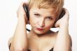 Close up portrait of young and attractive party girl with headph