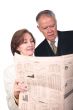 business partners reading financial paper