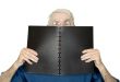 casual teacher with black notebook