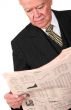 business manager reading newspaper