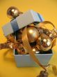 Blue gift box with golden balls