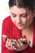 Beautiful woman smelling the flowers