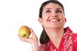 Pretty brunette holding an apple