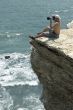 The photographer on a rock.