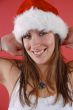 Young woman in a Santa hat