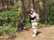Soldier aiming in the woodland