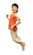 Boy jumps on white background.