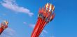 many red flags on blue sky