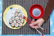 To have a meal Sushi on dinner with Chopsticks