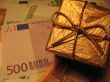 Golden christmas gift box and money