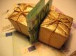 Two golden christmas gift box and money