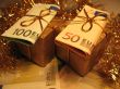 Two golden christmas gift boxes with money