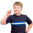 schoolboy writes a pen in air