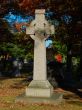 celtic cross at cemetery in autumn