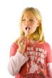 Little girl brushes her teeth