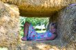 Cute girl on haybales