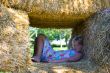 Cute girl on haybales