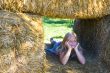 Cute girl on haybales