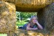 Cute girl on haybales