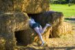 Cute girl on haybales