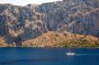 Yacht in front of a mountain