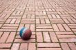 Ball on a pavement tiles