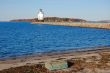 lighthouse, beach, and breakwater