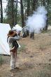 Mountain man firing his musket