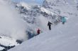 Three skiers traversing