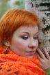 young red-haired woman in red scarf