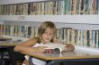 Girl in school library