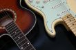 Closeup of 2 guitars