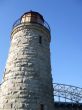 Antique Lighthouse and Modern Bridge