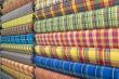 Colored rollers of fabric