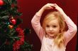 toddler girl and christmas tree