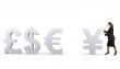 world currencies - business woman pushing yen