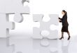 asian business woman building a puzzle