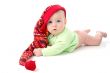a little baby in a large red hut portrait