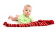 little baby in large red hut portrait
