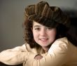 Smiling girl in a hat