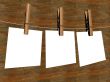 Three sheets of the paper, hanging on a cord. 3D image.
