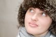 woman wearing a wool scarf and knit hat