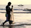 Man fishing in a sunset