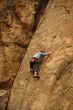 Climber on sheer rock face