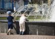 Two boys at a fountain