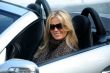 Blond girl in a car