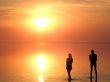 A black silhouette of a children on a sunset 2