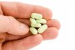 Man`s hand with pills