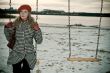 young girl alone on swing