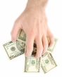hand takes dollars